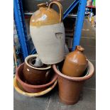A collection of stoneware planters and jugs including salt glazed examples.