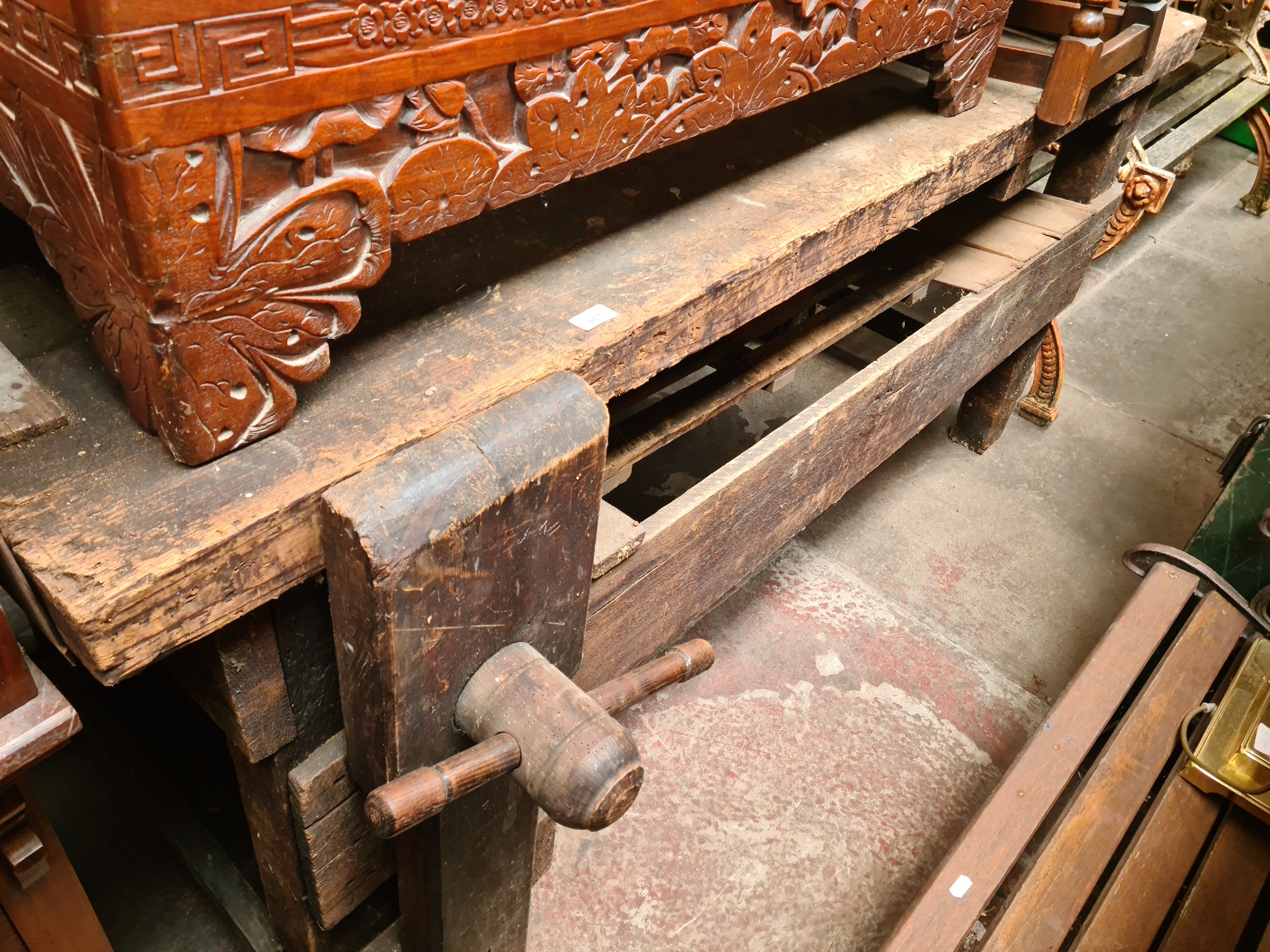 A wooden work bench with vice.