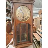 An oak wall clock.