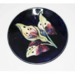 A Moorcroft pottery small pin dish, impressed marks, diameter 11.5cm.