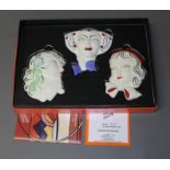 A boxed set of three Wedgwood Clarice Cliff face masks, with certificate. Condition - good, no