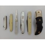 Six folding knives including silver bladed and mother of pearl handled examples.