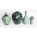 A group of four red clay green glaze Oriental vases, tallest 31cm.