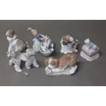 A group of six Lladro figures, five boxed. Condition - dog with bird to tail is currently loose,