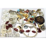 A tray of assorted vintage and antique costume jewellery including marble cherry bakelite beads, a