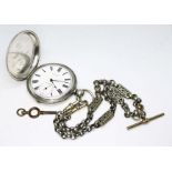 A full hunter pocket watch marked 'Fine Silver' on white metal Albert chain.