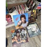 A box of LPs and 45s to include David Bowie, Elton John, Queen, 10CC, etc.