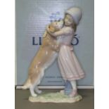 A Lladro figure "A Warm Welcome", number 6903, height 25.5cm, with box. Condition - good, no