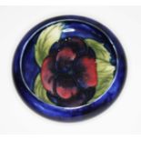 A Moorcroft pottery small dish, impressed marks, diameter 11cm.