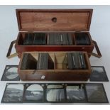 Two wooden cases containing large quantity of Victorian and later glass slides depicting various