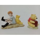 Two Royal Doulton Winnie the Pooh figurines.