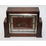 A 1930s mahogany cased mantle clock, length 31cm.