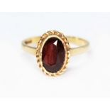 A hallmarked 9ct gold garnet ring, gross wt. 2.6g, size N/O.