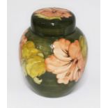 A green ground Moorcrfot pottery ginger jar, paper label, impressed and painted marks. Condition -