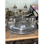 A silver plated desk stand with eagle and glass ink wells and one other.