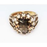 A hallmarked 9ct gold smokey quartz and colourless stone cluster ring, gross wt. 5.1g, size M.