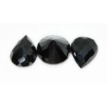 A loose round brilliant cut black diamond weighing approx. 6.5ct (1.3g) and a pair of pear cut black