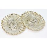 A pair of repouse pin dishes, each marked 'Sterling Silver', length 9.5cm, wt. 74.5g.