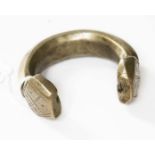 An early 19th century West African Manilla "slave money" currency bangle.