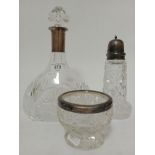 3 pieces of glassware to include decanter, bowl and a sugar sprinkler, all with silver collars and
