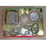 A tin of assorted hallmarked silver comprising two cigarette cases, a bangle, a twin handle cup,