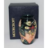 A Moorcroft pottery vase decorated in Oberon pattern, impressed and painted marks, height 10cm, with