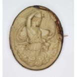 A 19th century yellow metal mounted lava cameo brooch, length 52mm.