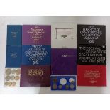 A box containing a collection of UK coin sets, proof and uncirculated including 1953.