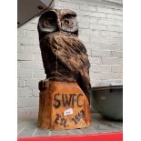 A large hand carved wooden owl,( as found) with carved SWFC on base