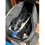 A Sony video camera with bag and accessories.
