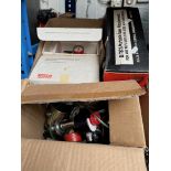 A box containing gas bottle regulators, and a Black & Decker Circular saw attachment