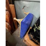 A blue velvet church kneeling stool.