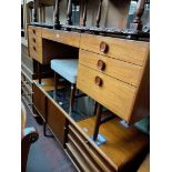 A mid 20th century teak dressing table and stool by Meredew.