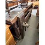 A wooden work bench with vice. Dimensions:- 185cm width, 86cm height, 66cm depth.