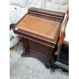 A reproduction mahogany Davenport desk.