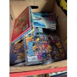 A box containing mostly comics, X men etc and a few annuals He-Man, Thundercats