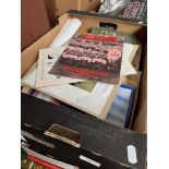 A box containing sports programs, signed England cricket photograph 1988, golf badges, signed