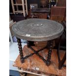 An Eastern brass top table.