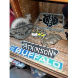 A collection of vehicle badges including Atkinson, Volvo, British Leyland Buffalo, a bronzed