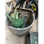 A galvanised dolly tub - AF ( holes on a side ), two galvanised watering cans, a metal washboard and