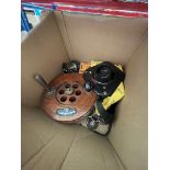 A box of fishing equipment to include reels, weights, etc.