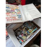 A box of postcards and matchbox labels, etc.