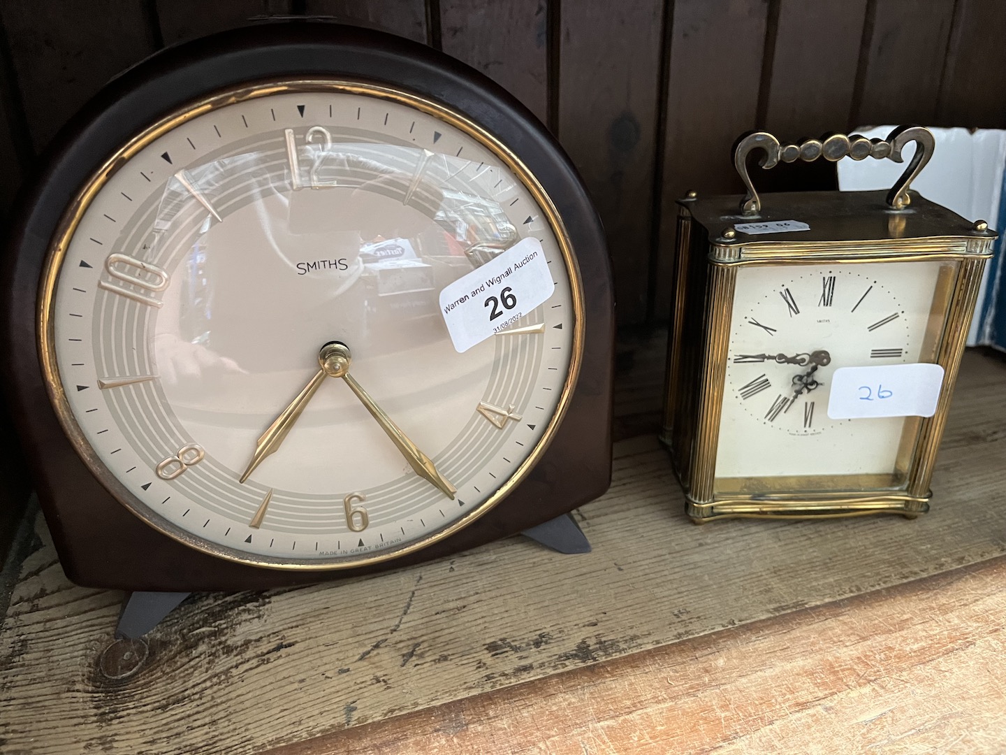 A Smith's Bakelite mantle clock and a Smith's carriage clock.