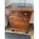 An early 20th century mahogany canteen of silver plated cutlery in drawers, standing on ball and