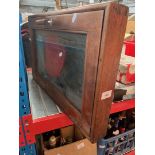 A small glass fronted table top display cabinet