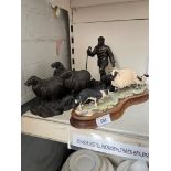 A Border Fine Arts figure signed Ayres and a Heredites bronze effect figure.