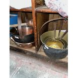 A collection of brass and copperware including jam pan, brass pans, posser