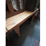 A pine kitchen dining table.