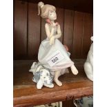 Lladro figure of a girl with dog. Ht. 20cm