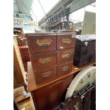 An early 20th century oak chest of six filing drawers.